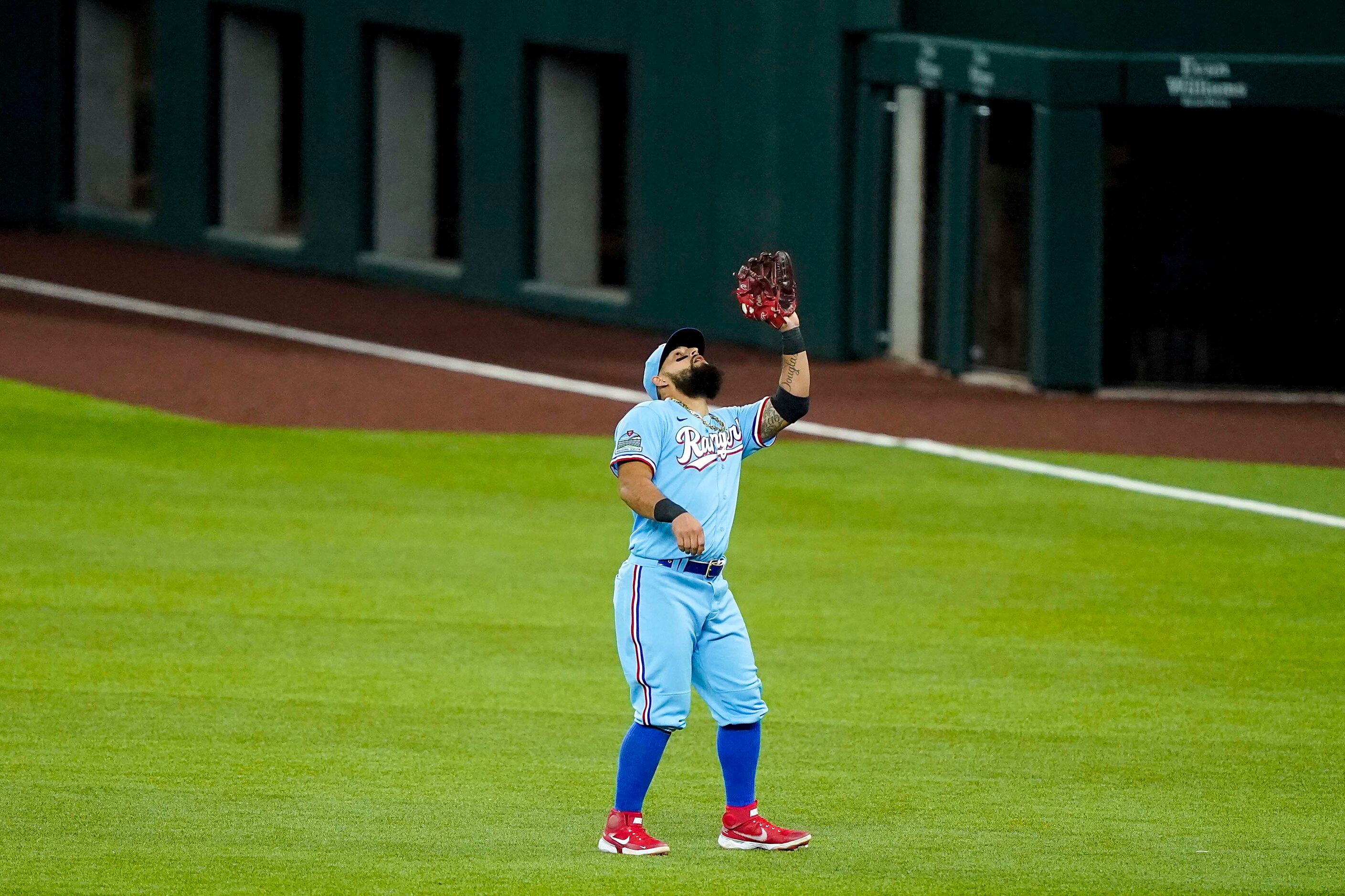 Texas Rangers second baseman Rougned Odor catches a popup off the bat of Colorado Rockies...