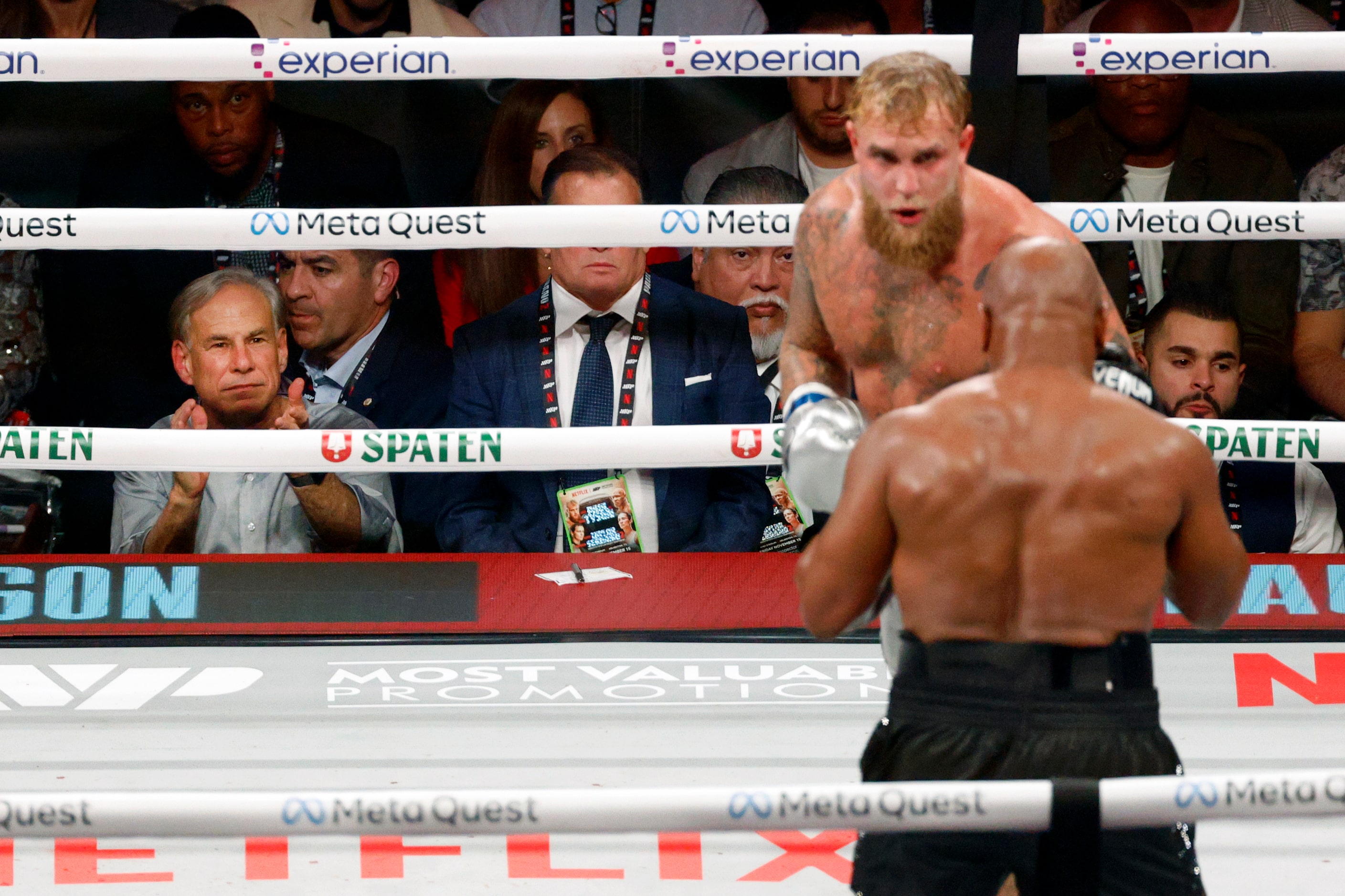 Gov. Greg Abbott claps as Jake Paul and Mike Tyson fight during round five of a heavyweight...