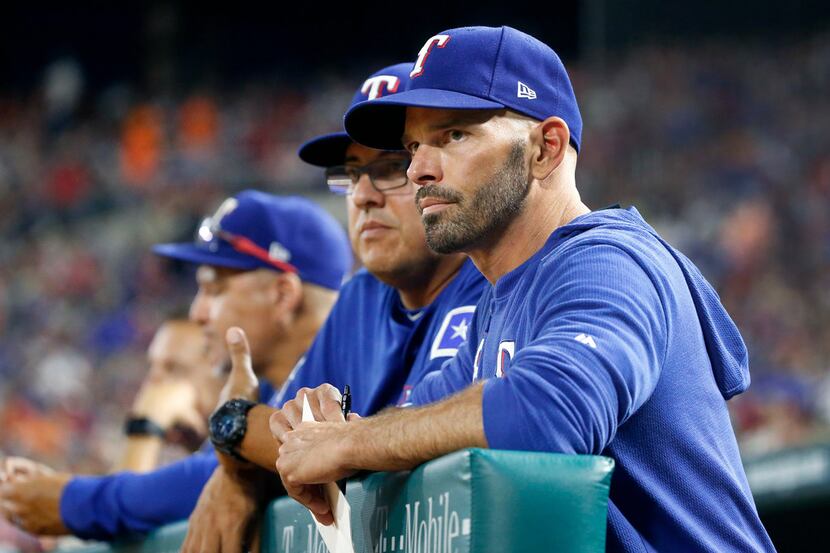 Texas Rangers manager Chris Woodward is pictured in the dugout during the Houston Astros...