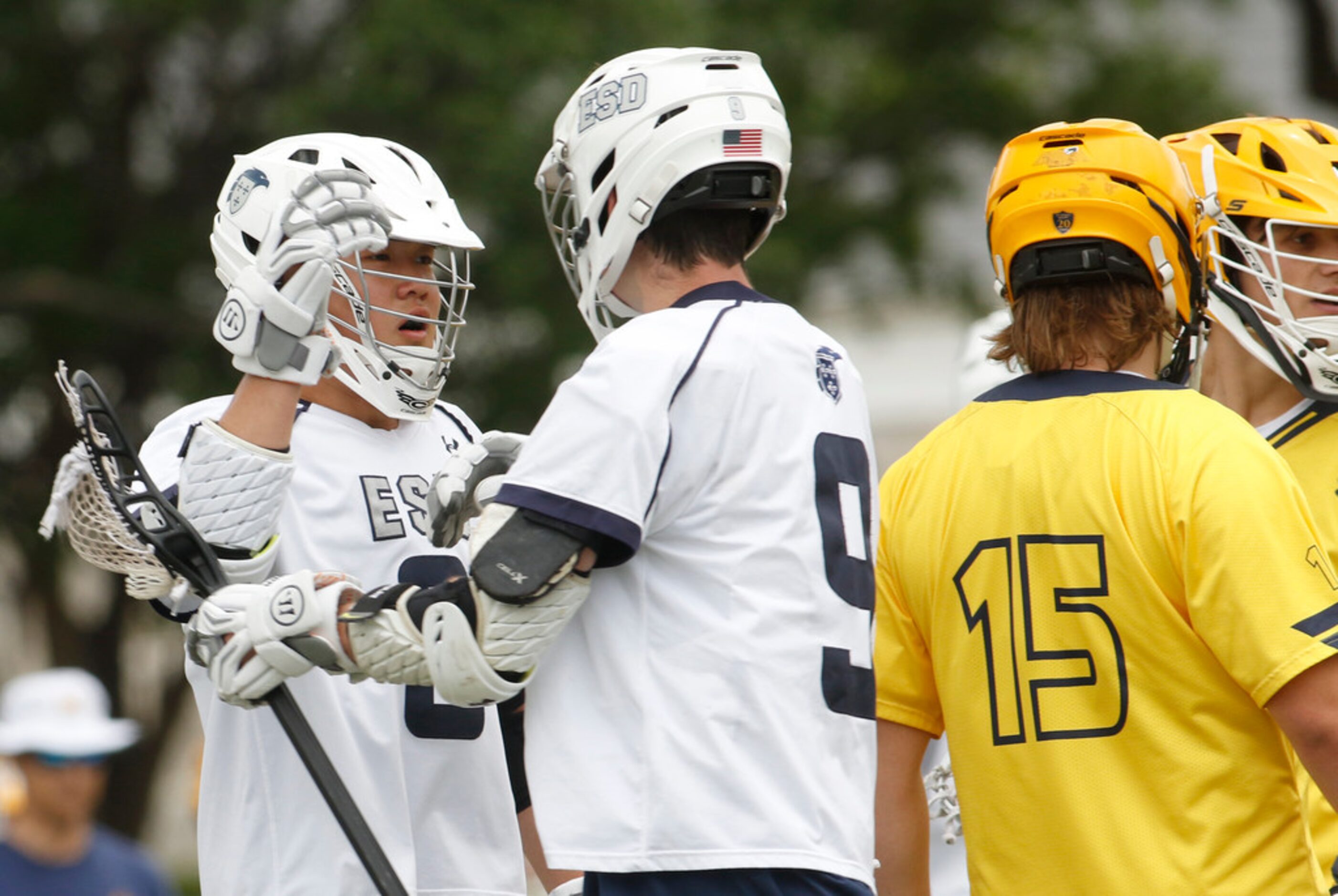 ESP's Danny Kung (8), left, celebrates with teammate Drew Wasserman (9) after Kung's first...