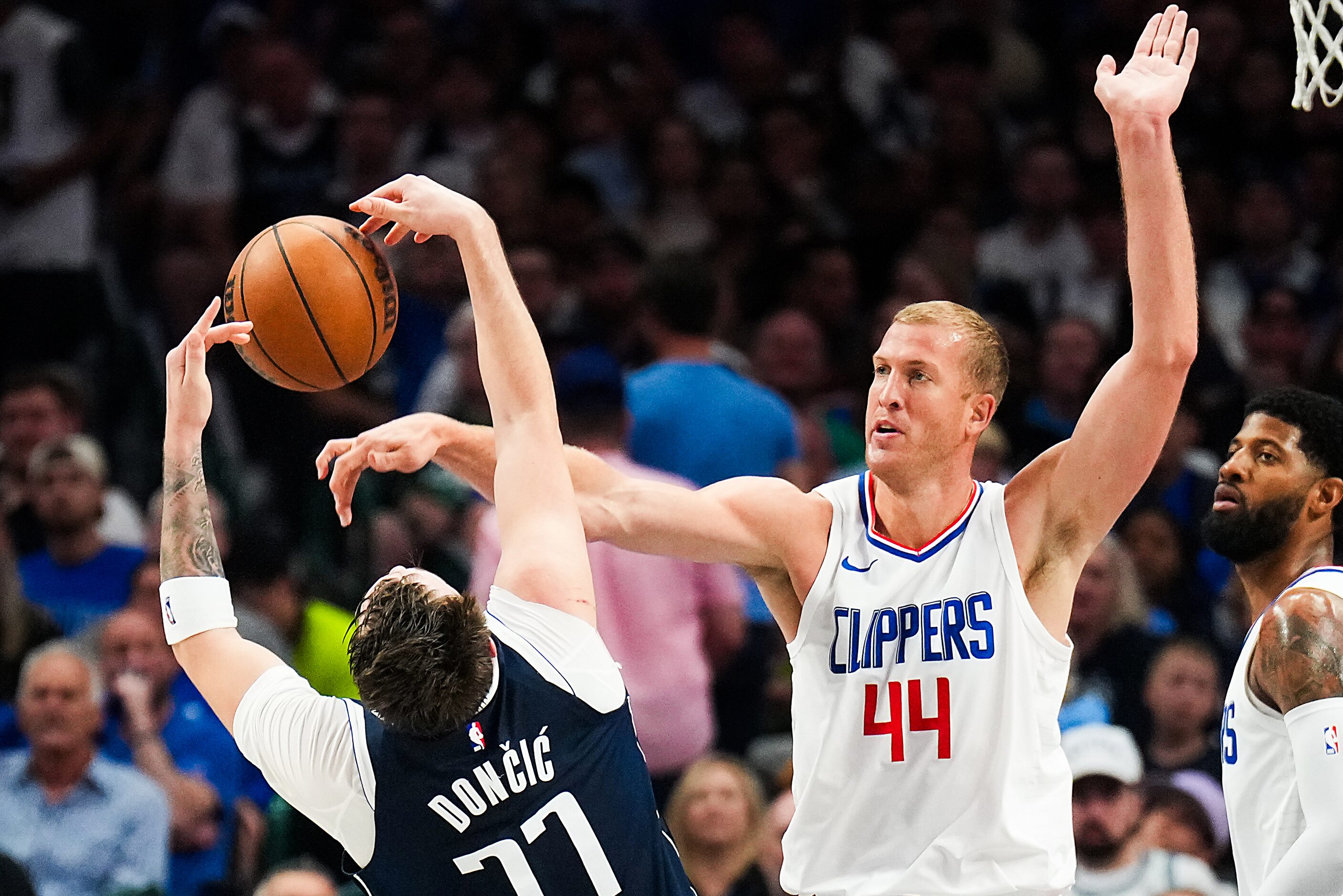 Dallas Mavericks guard Luka Doncic (77) is fouled by LA Clippers center Ivica Zubac (40)...