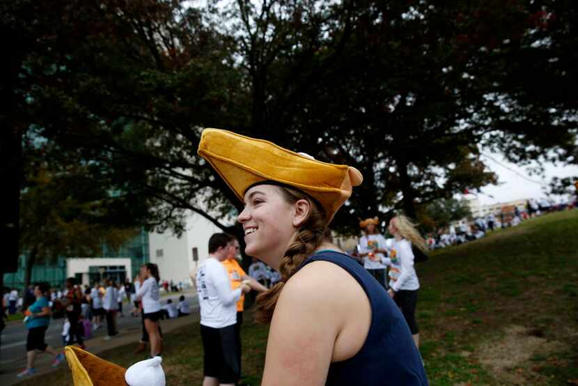 Rachel Wiggans wears a pumpkin pie hat at the Dallas YMCA Turkey Trot in downtown Dallas on...
