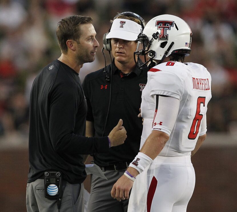 Texas Tech Red Raiders head coach Kliff Kingsbury talks with Texas Tech Red Raiders...