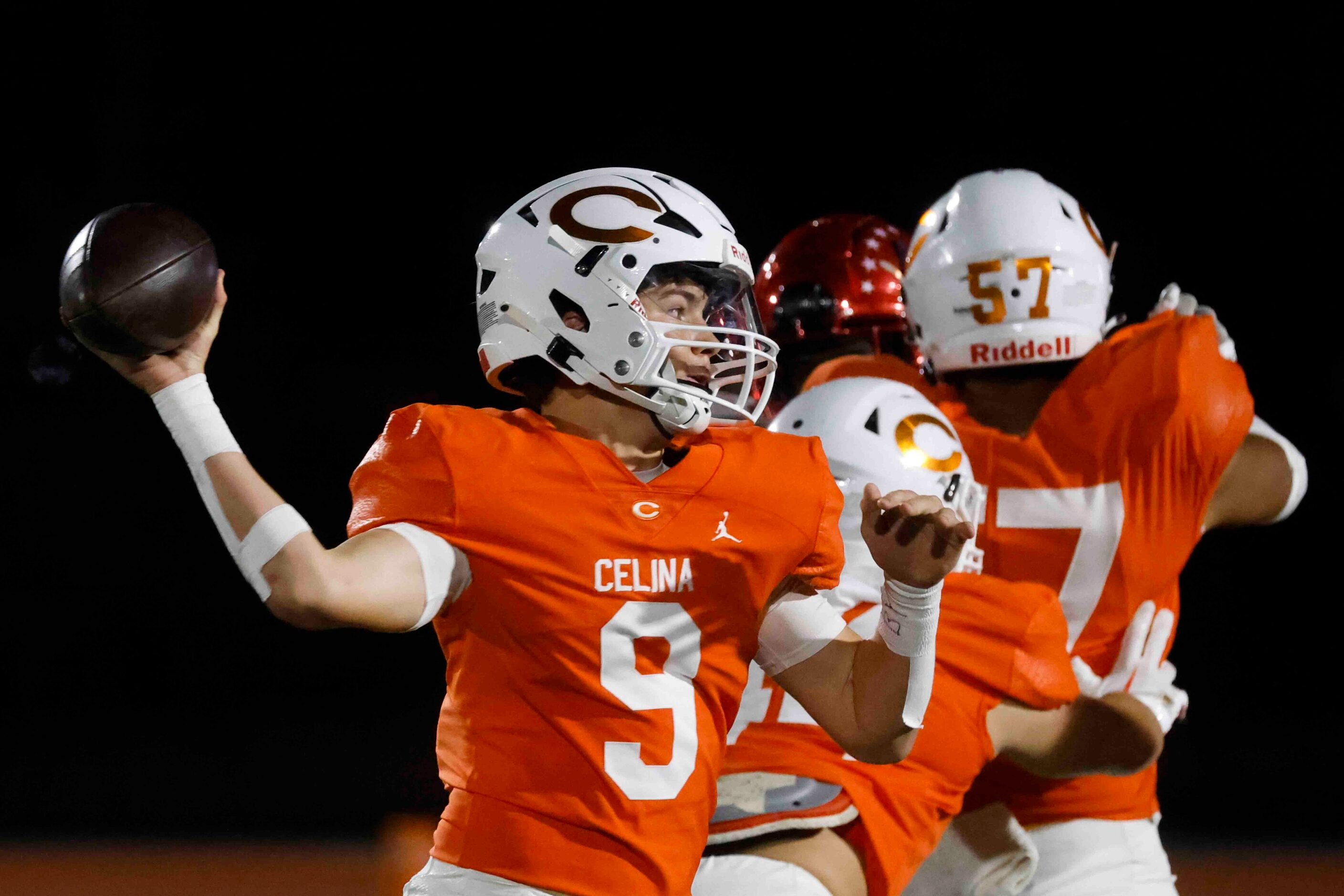 Celina High School’s QB Knox Porter throws the ball against David W. Carter High School...