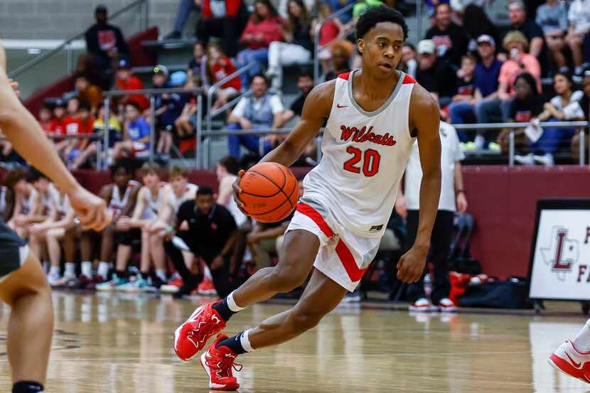 Lake Highlands guard Tre Johnson looks for room against the Arlington Bowie defense during a...