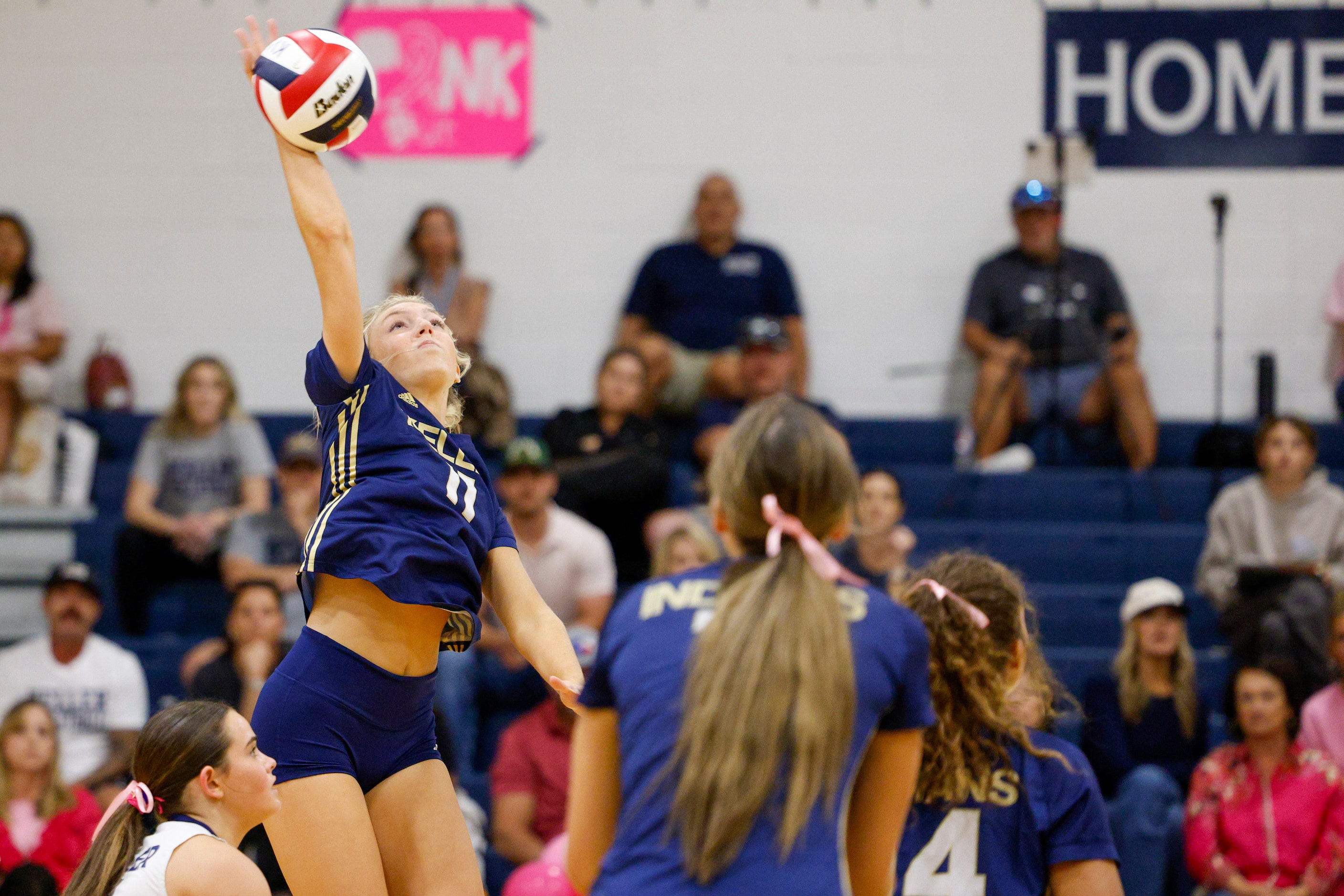 Keller's Brooklyn Harter (11) hits the ball during a high school volleyball match against...