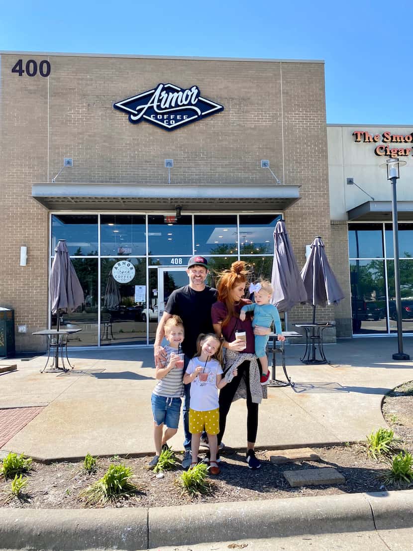 Mike and Jenn Todryk with their three children in front of Armor Coffee Co. in The Village...