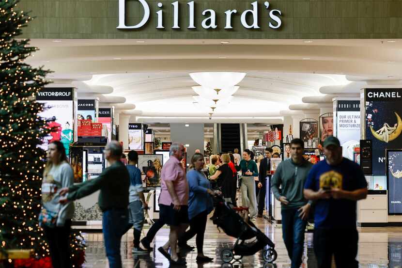 Shoppers walk past Dillard’s at NorthPark Center in Dallas, Friday, Dec. 10, 2021. (Elias...