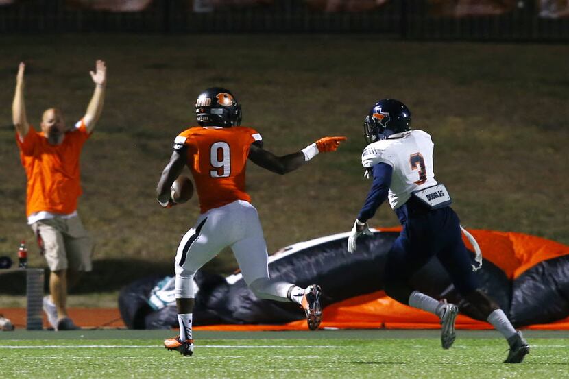 TXHSFB Rockwall wide receiver Sam Crawford (9) looks back and gestures to Sachse defensive...