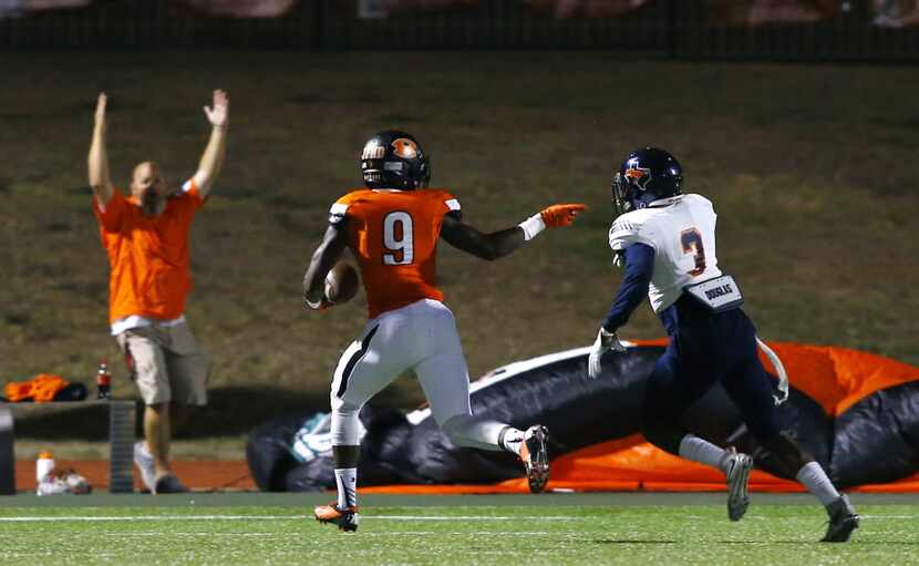 TXHSFB Rockwall wide receiver Sam Crawford (9) looks back and gestures to Sachse defensive...