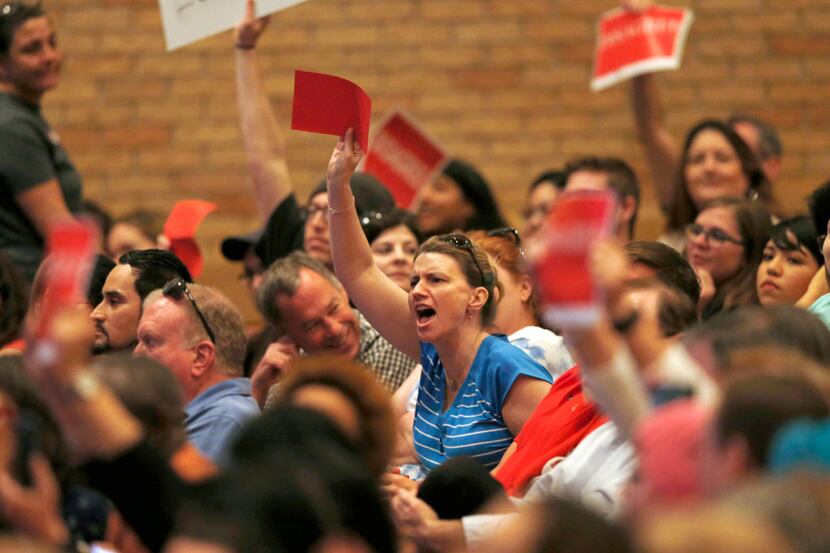 People voice their opinion during a town hall meeting with Rep. Pete Sessions, R-Dallas in...