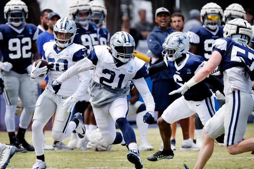 Dallas Cowboys running back Ezekiel Elliott (21) gets out in front to block for fellow...