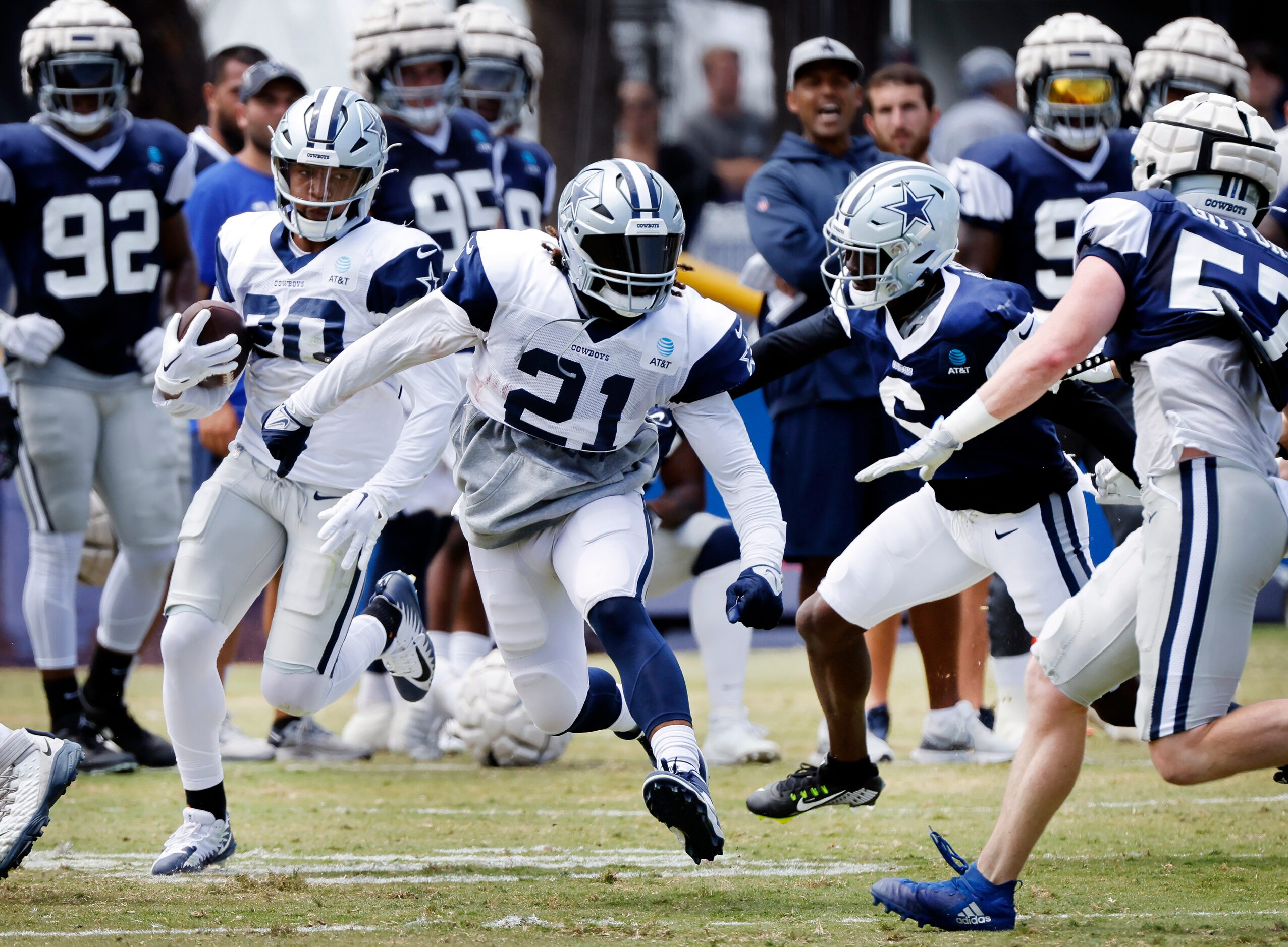 Dallas Cowboys running back Ezekiel Elliott (21) gets out in front to block for fellow...