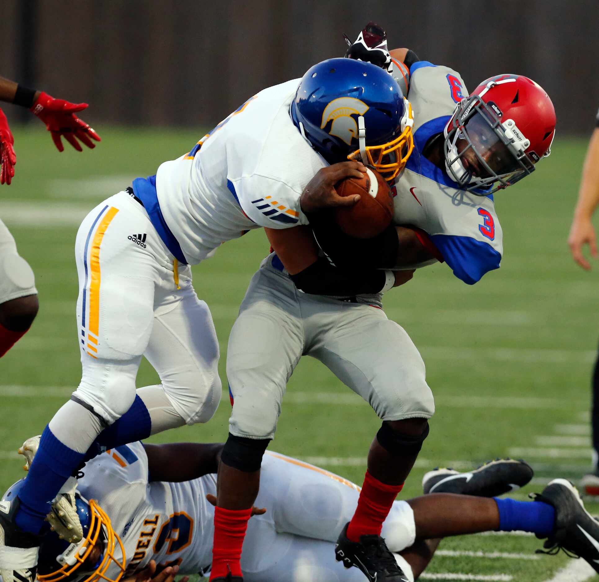 Samuell defender Jarad Martinez (8) forces Spruce QB Timad Cotton (3) out of bounds during...