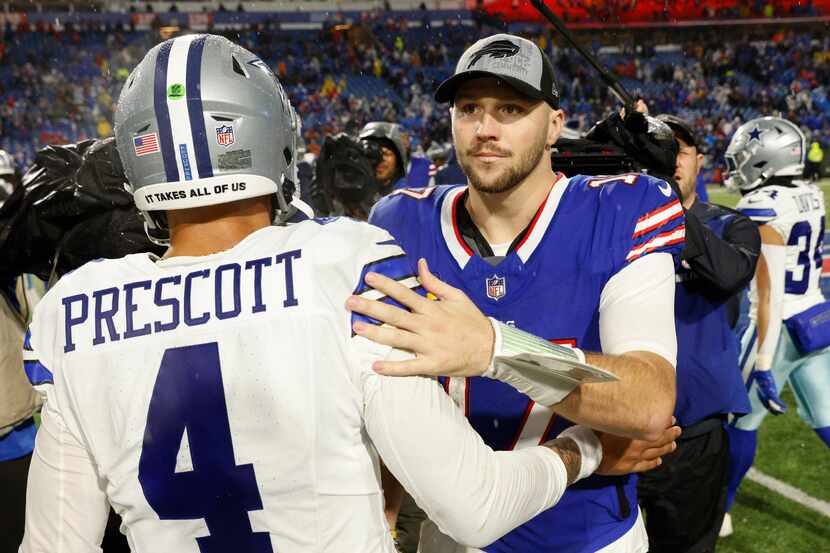 Dallas Cowboys quarterback Dak Prescott (4) shakes hands with Buffalo Bills quarterback Josh...