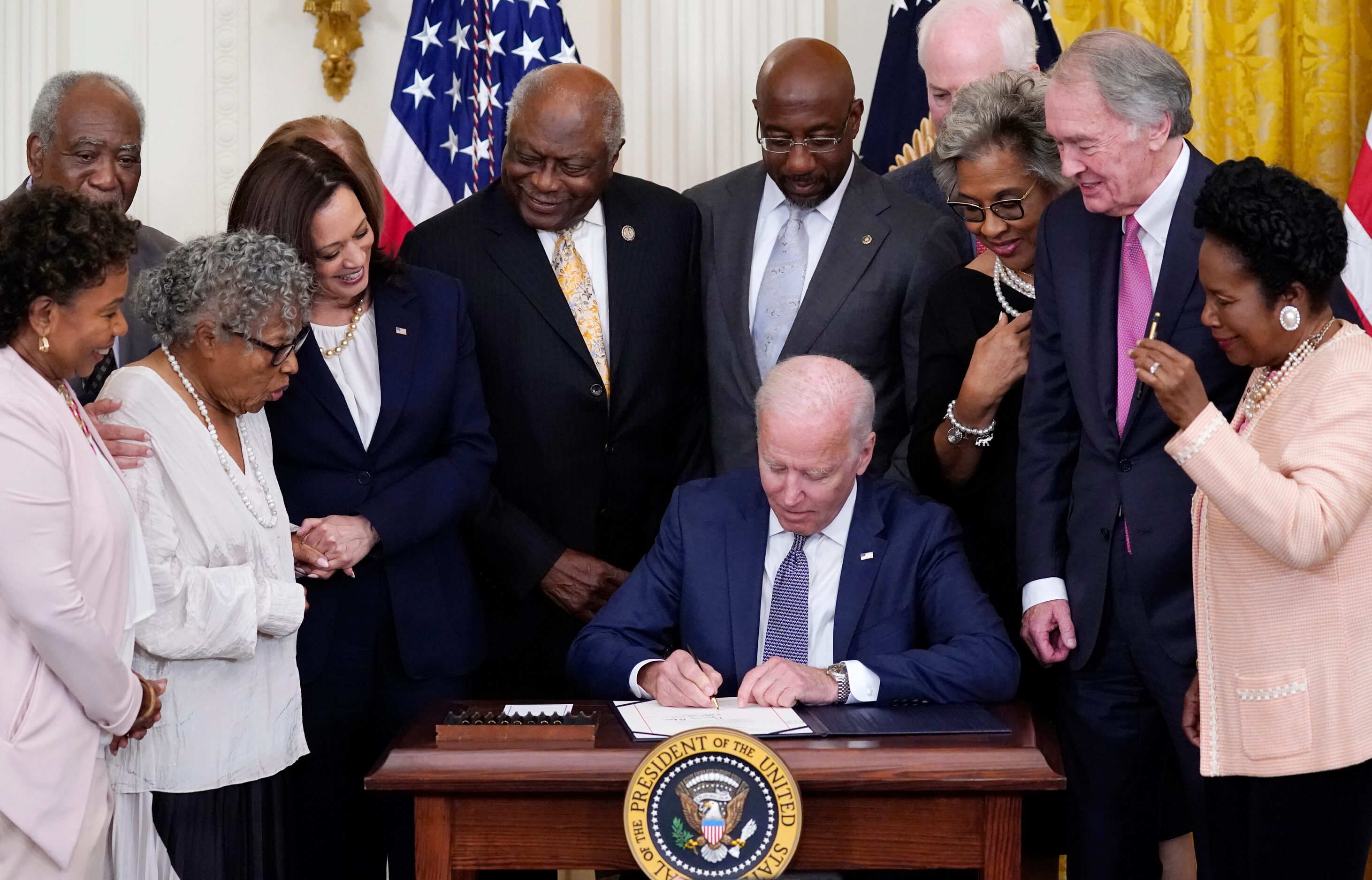 President Joe Biden signs the Juneteenth National Independence Day Act, in the East Room of...