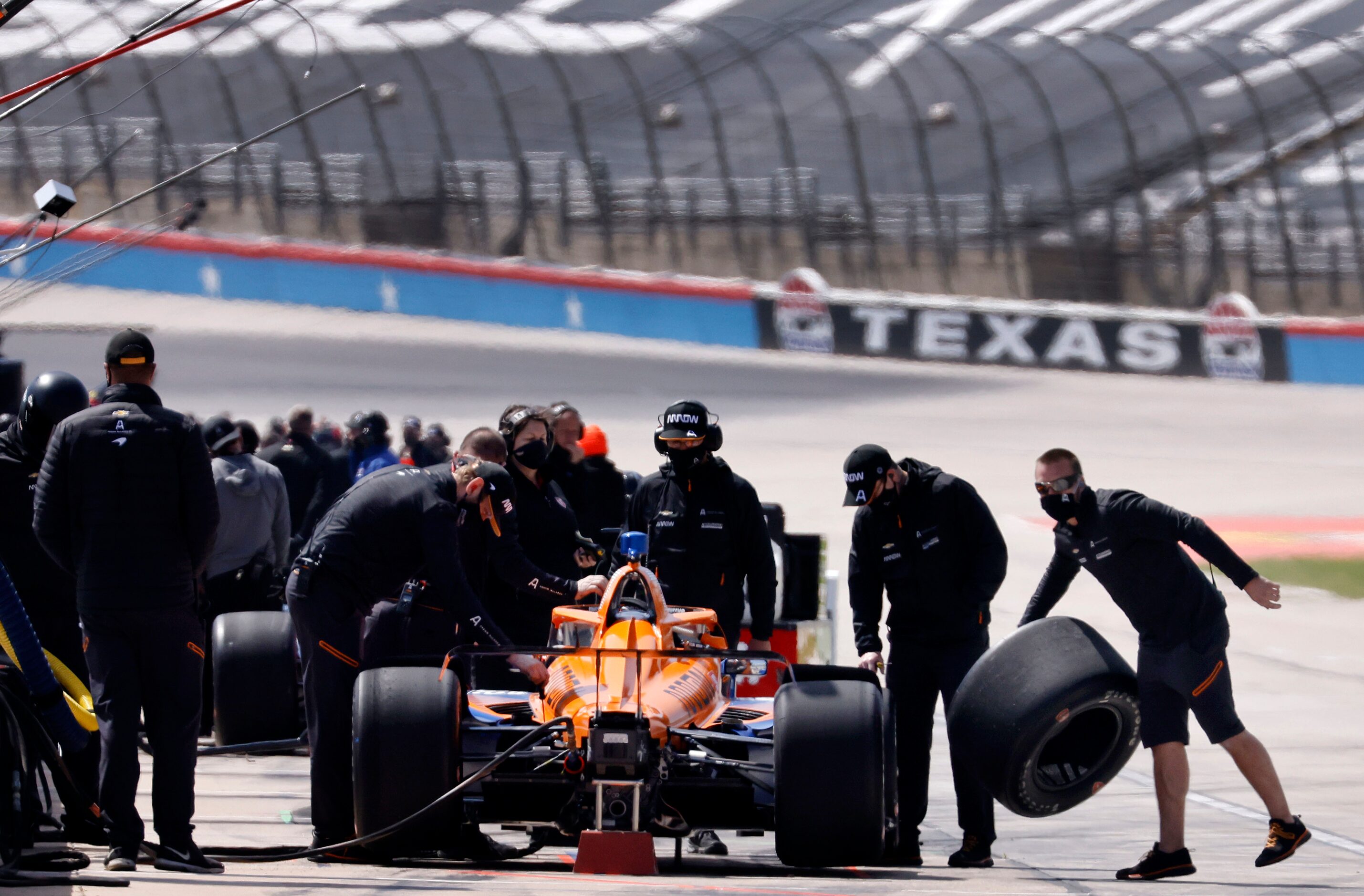 Crewman for Indy Car driver  Felix Rosenqvist change tires during a practice session in...