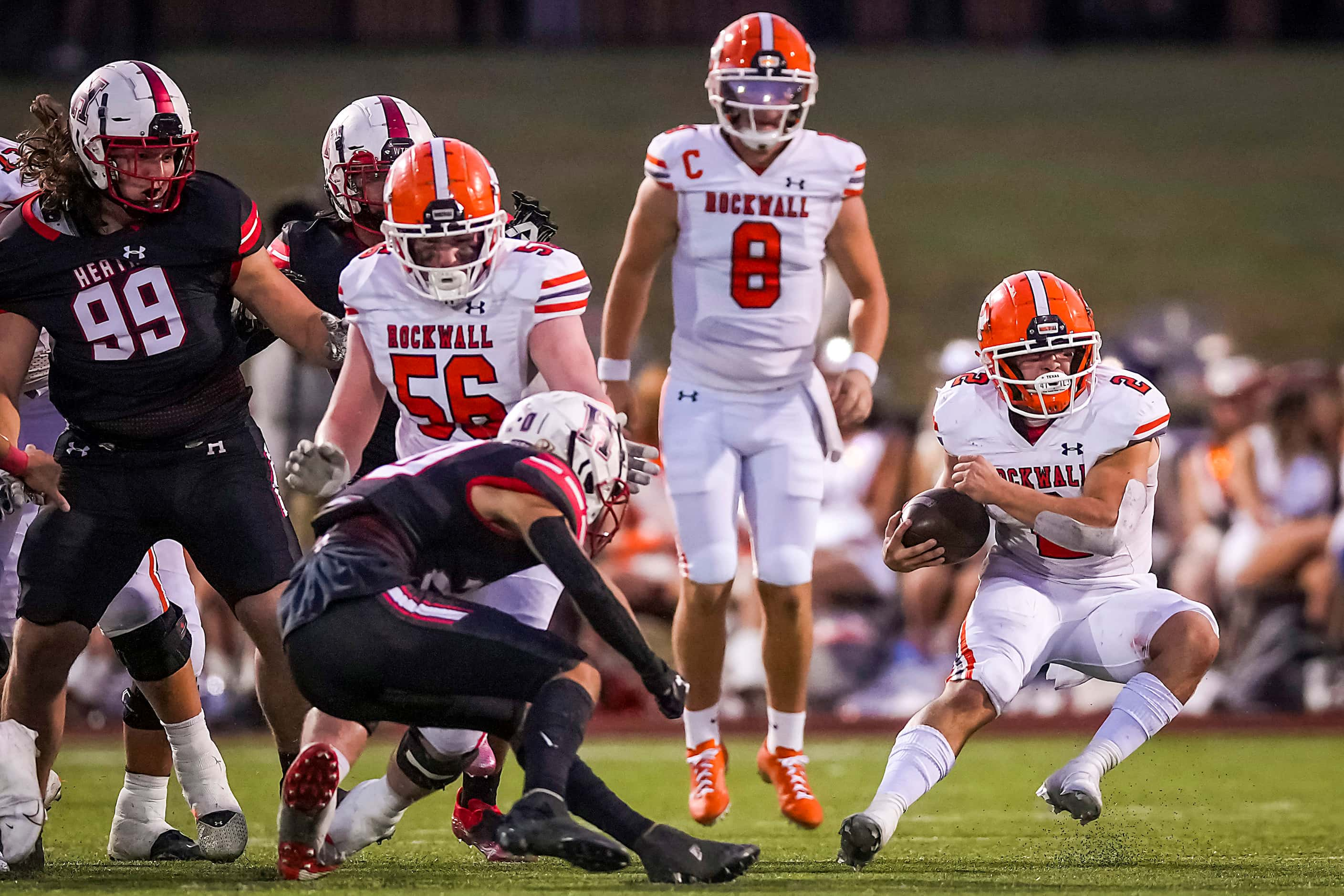 Rockwall running back  Zach Hernandez (2) breaks into the Rockwall-Heath secondary during...