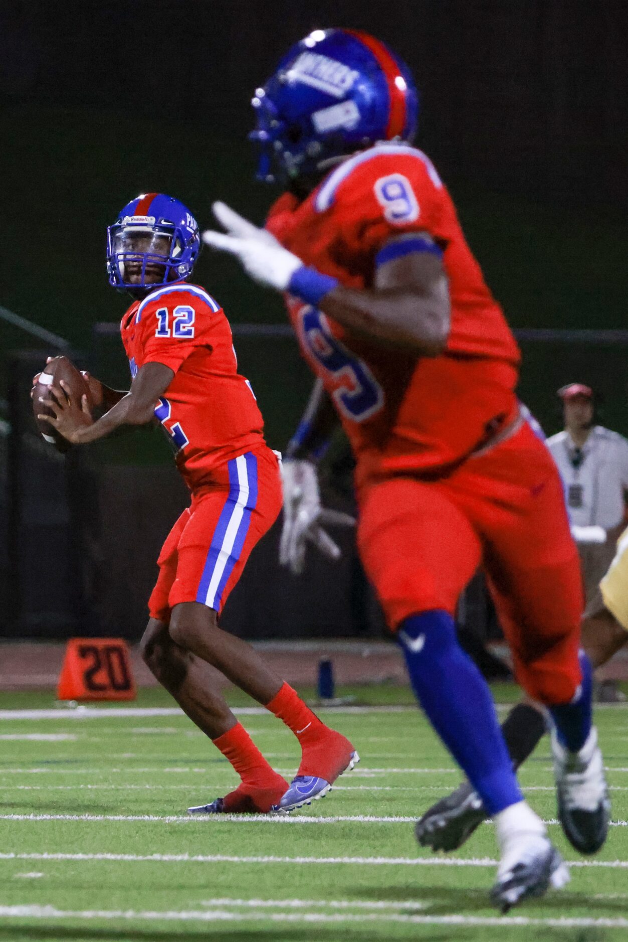 Duncanville High School Jameir Willis (12) looks to pass to Duncanville High School Jerrale...