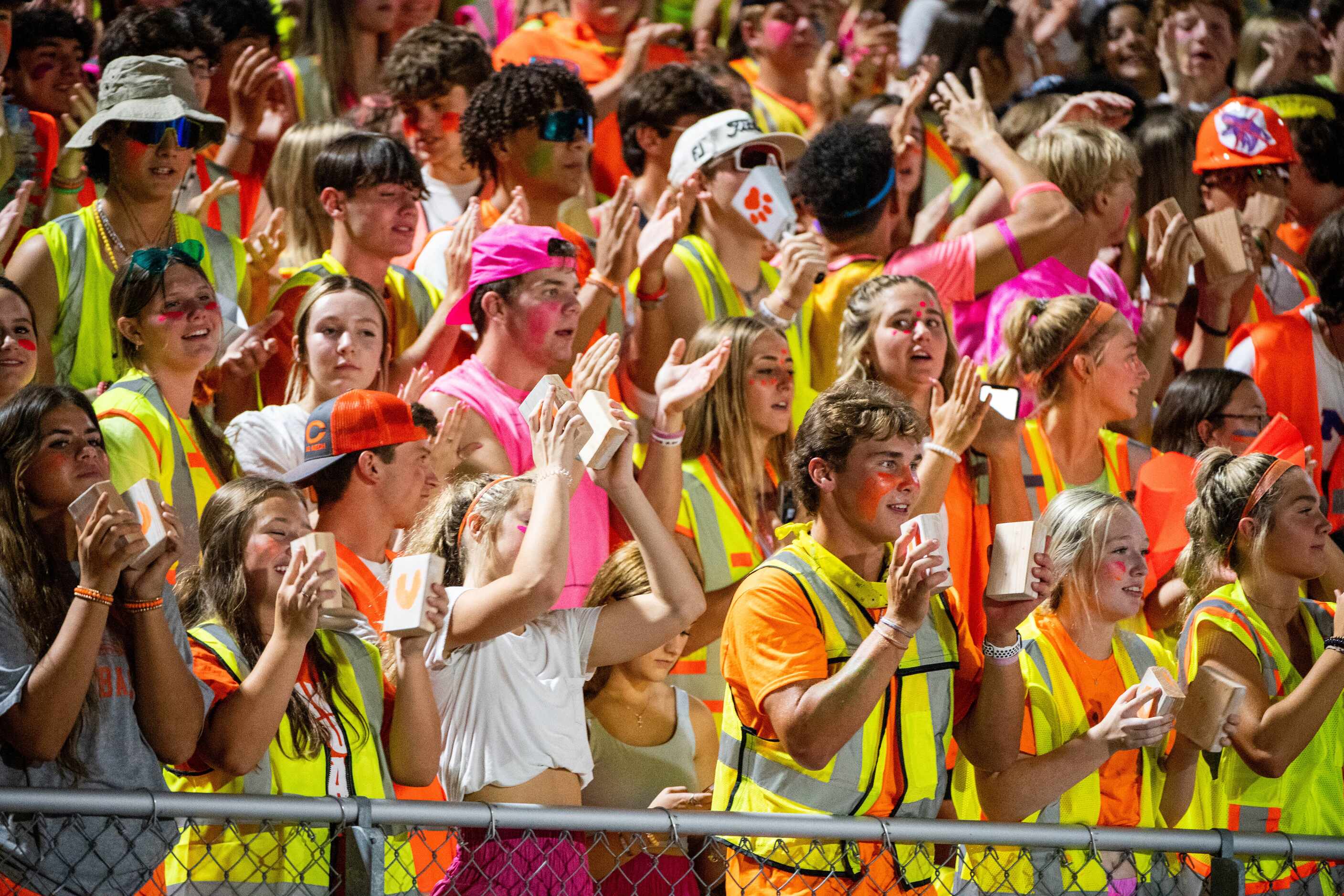 Celina students cheer in the first half during a high school football game against Anna,...