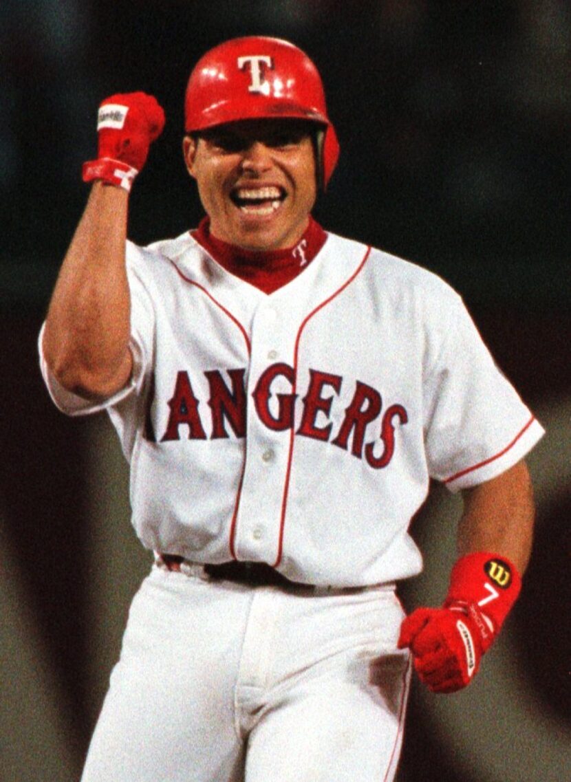 Caption: 10/4/96---Rangers batter Ivan Rodriguez  pumps his fist in excitement at second...