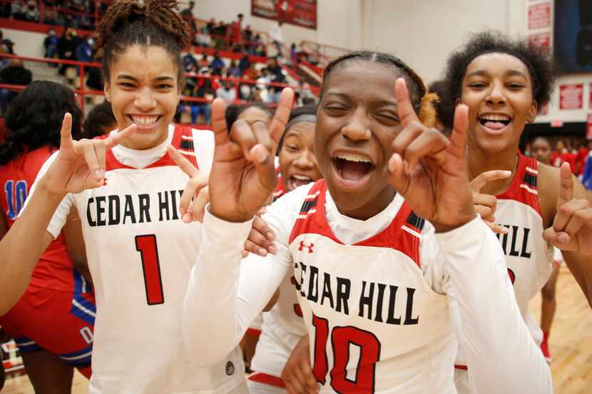 Cedar Hill players celebrate after their 81-72 overtime victory over Duncanville on January...
