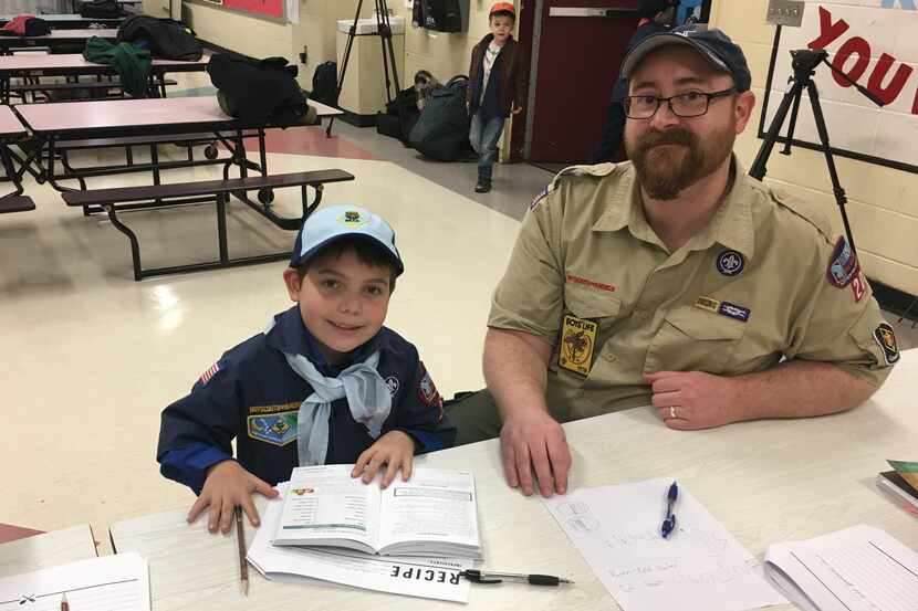 Cub Scout Joe Maldonado with a den leader.