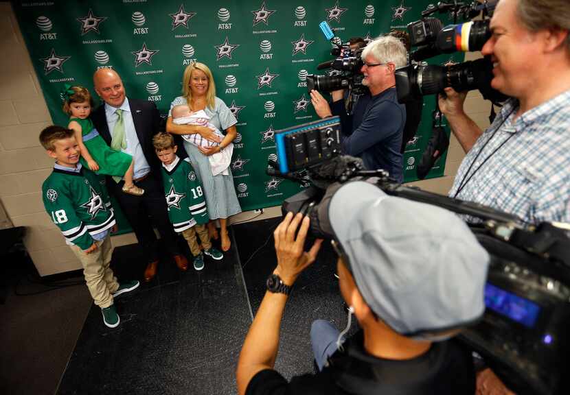 New Dallas Stars head coach Jim Montgomery poses for the media with his wife Emily,...