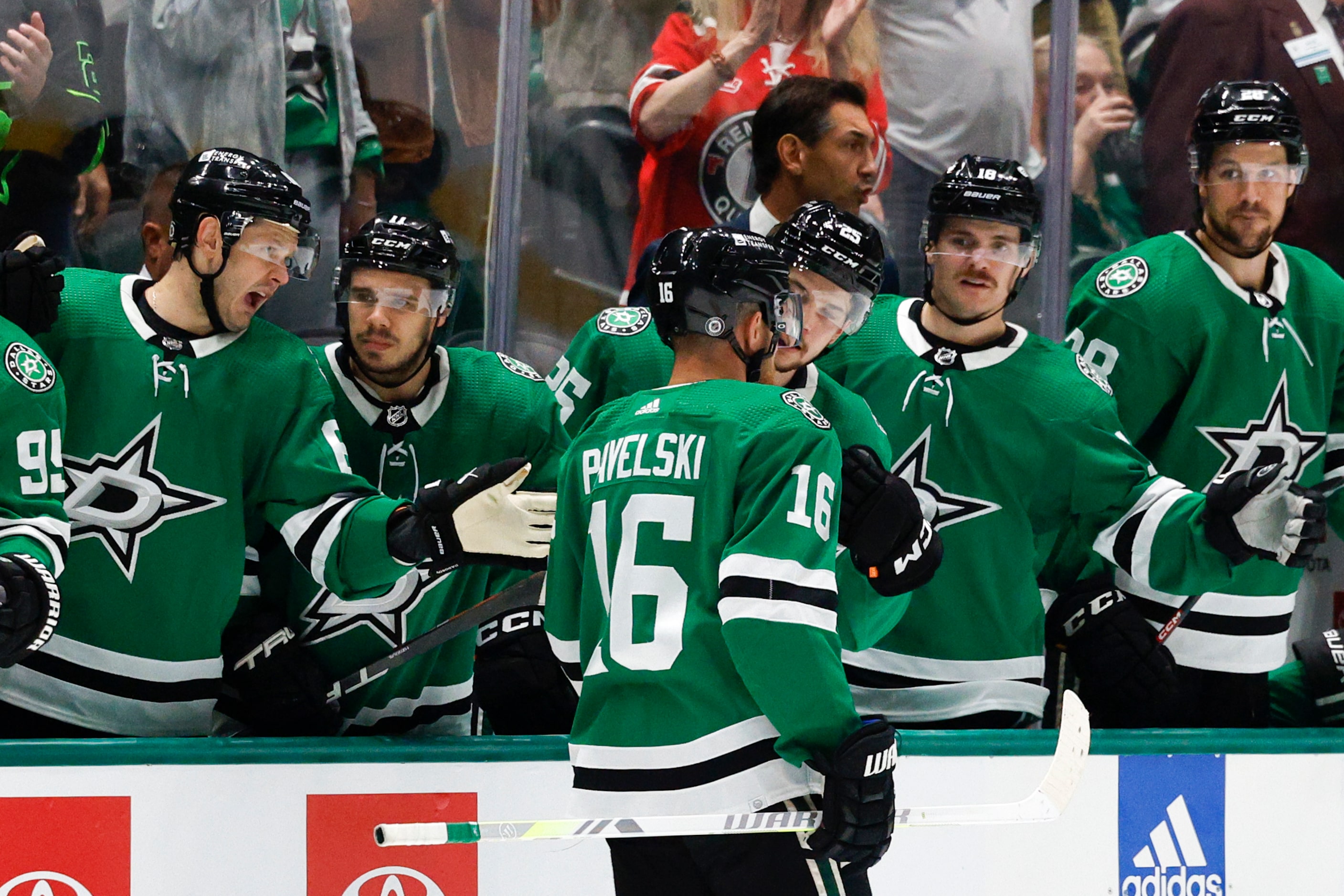 Dallas Stars center Joe Pavelski (16) celebrates his goal with teammates on the bench during...