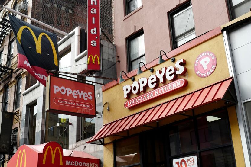 A McDonald's and a Popeyes are shown, Wednesday, Feb. 1, 2017, in the Brooklyn borough of...