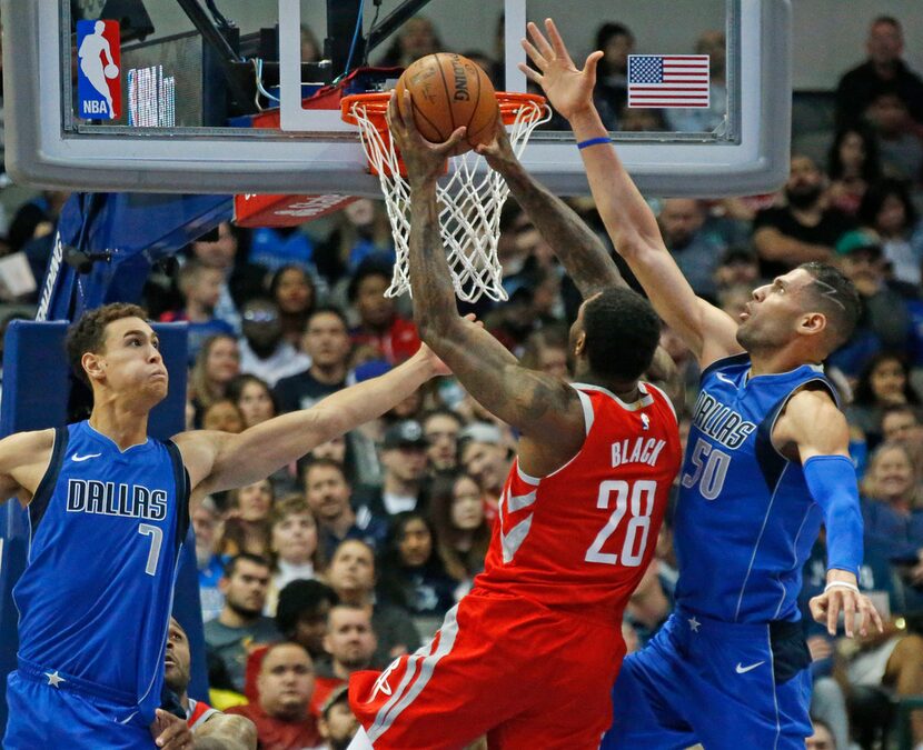 Dallas Mavericks Dwight Powell (7) and Salah Mejri (50) defend against Houston Rockets...