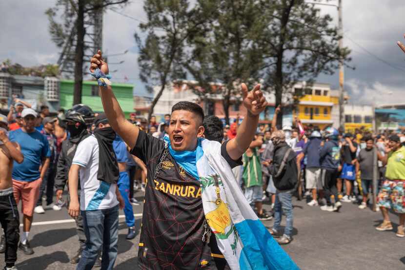 Demonstrators block a highway during a national strike in Guatemala City, Tuesday, Oct. 10,...