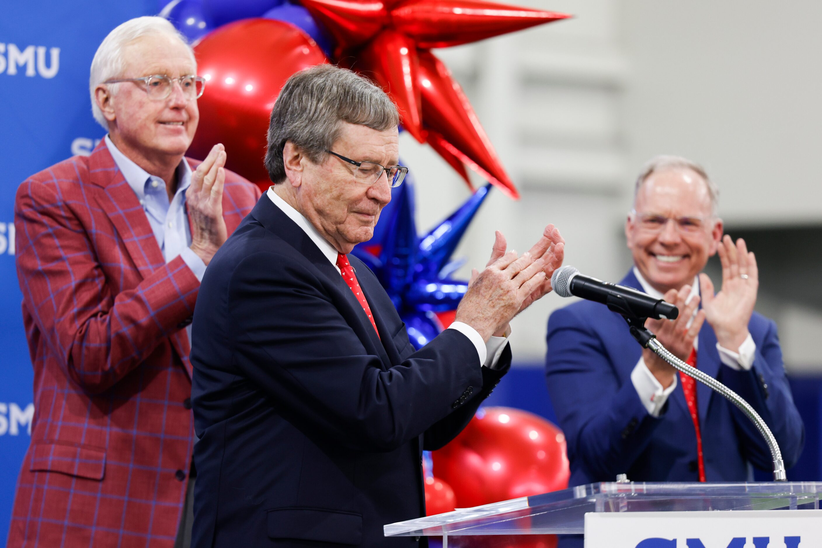 SMU board chair David Miller (left) and vice president for development and external affairs...