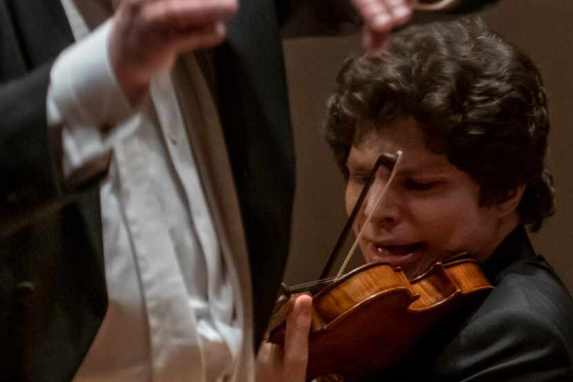 Violin soloist Augustin Hadelich performs with the Dallas Symphony Orchestra under guest...