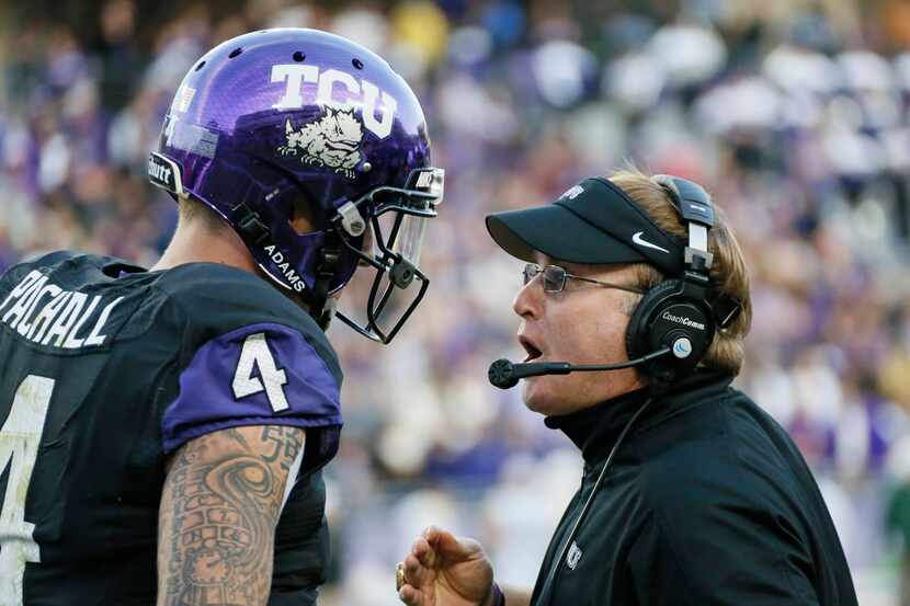TCU head coach Gary Patterson, right, talks with quarterback Casey Pachall (4) in the third...