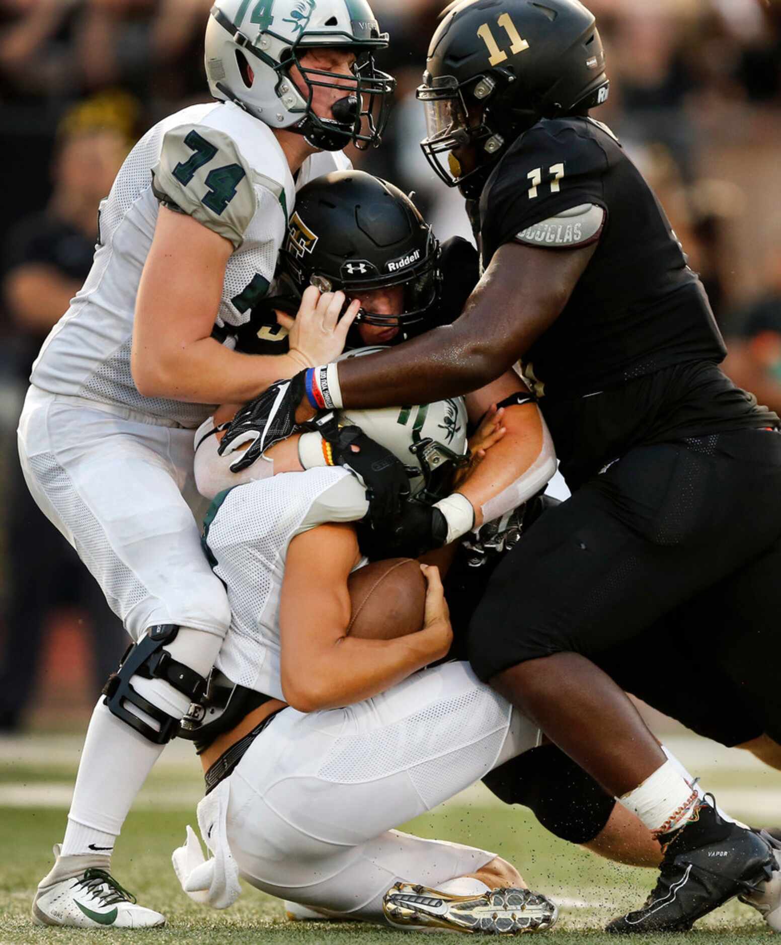 Frisco Reedy quarterback Jalen Kitna (11) is sacked by The Colony defensive end Stephen...