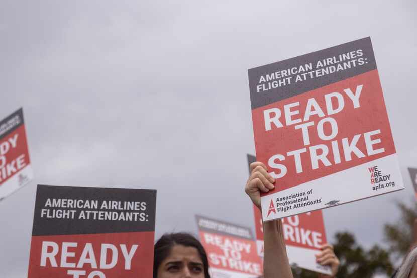 American Airlines' flight attendants hold a surprise picket outside of the American Airlines...