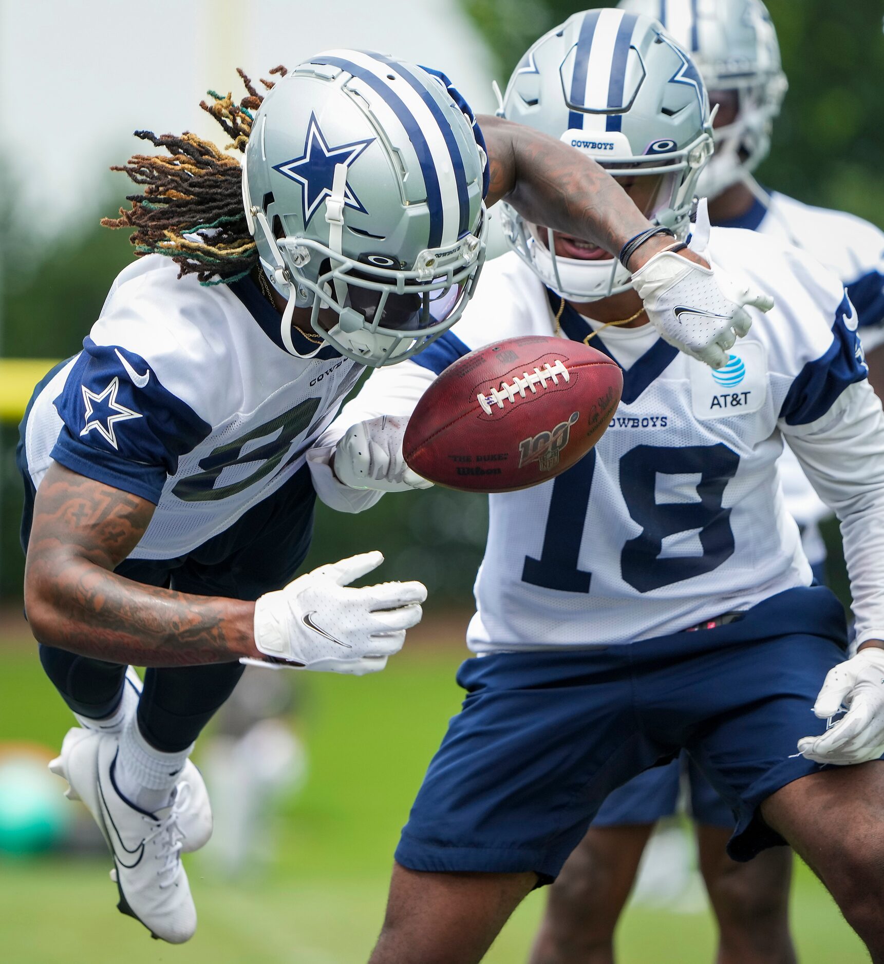 Dallas Cowboys wide receiver CeeDee Lamb (88) loses the ball while participating in a fumble...