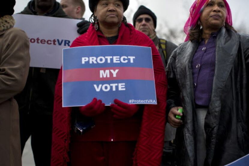 People wait in line outside the Supreme Court in Washington, Wednesday, Feb. 27, 2013, to...
