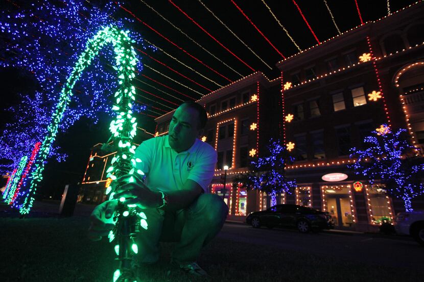 One week out before Frisco's Square light show, Jeff Trykoski checks placement of LED lights...