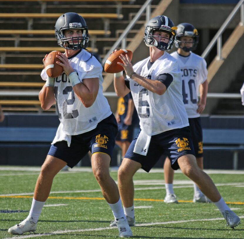 Highland Park High School quarterbacks Michael Clarke (12) and Jack Fain (6) are pictured at...