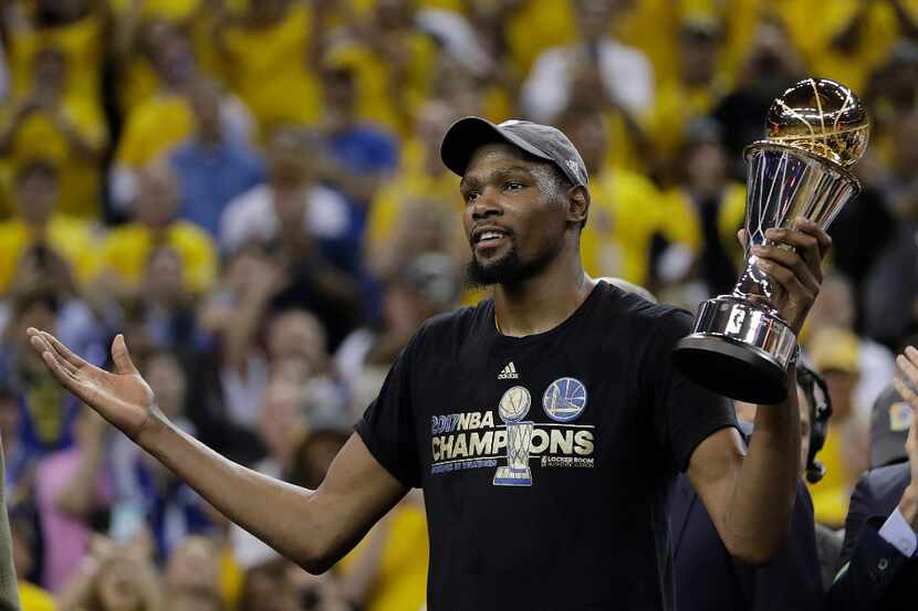 FILE - In this June 12, 2017, file photo, Golden State Warriors forward Kevin Durant...