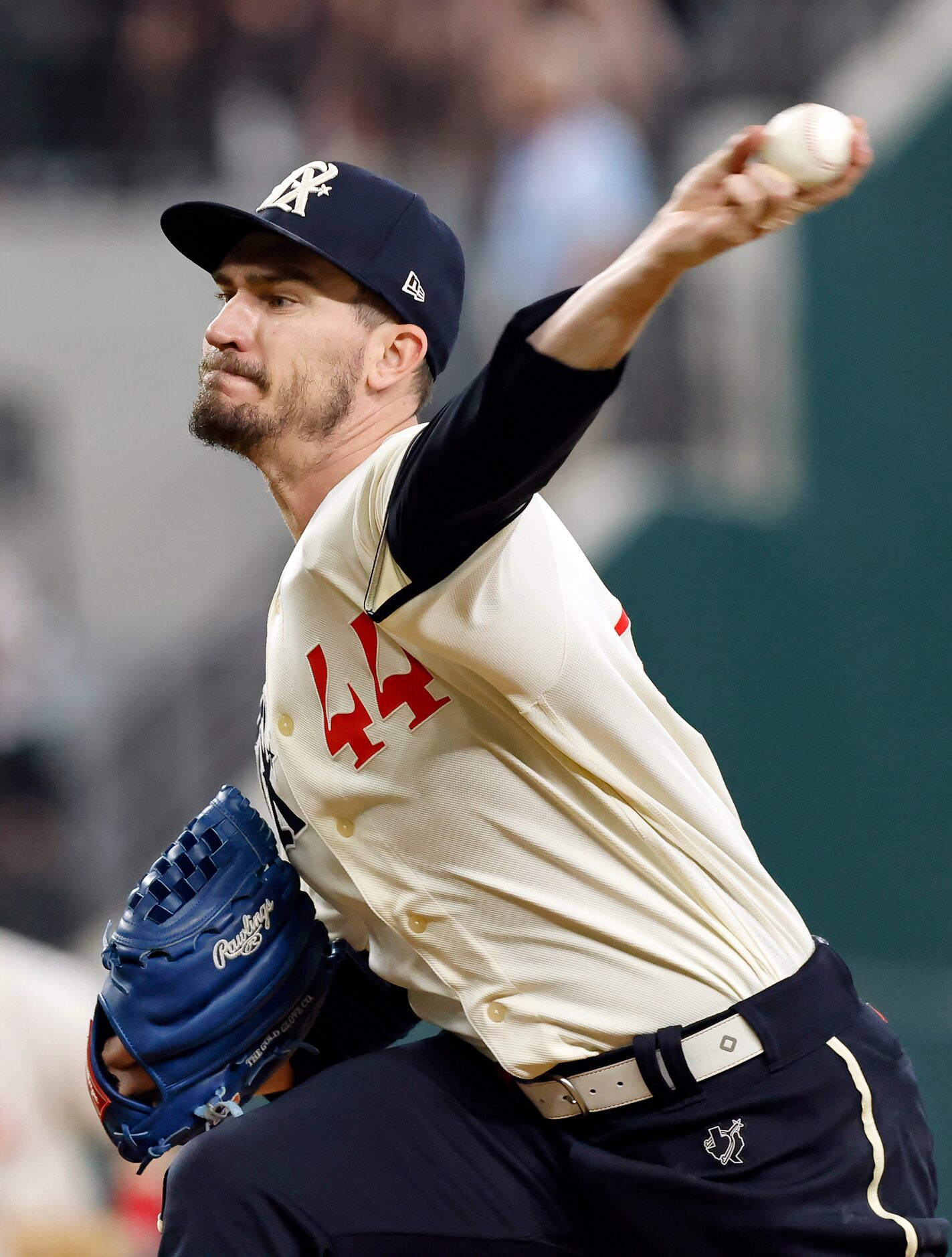 Texas Rangers starting pitcher Andrew Heaney (44) throws against the Cleveland Guardians in...