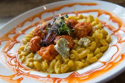 Buffalo Mac n' Cheese at V-Eats Modern Vegan is made with fried cauliflower nuggets tossed...