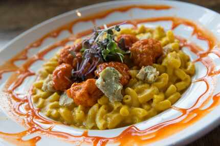 Buffalo Mac n' Cheese at V-Eats Modern Vegan is made with fried cauliflower nuggets tossed...