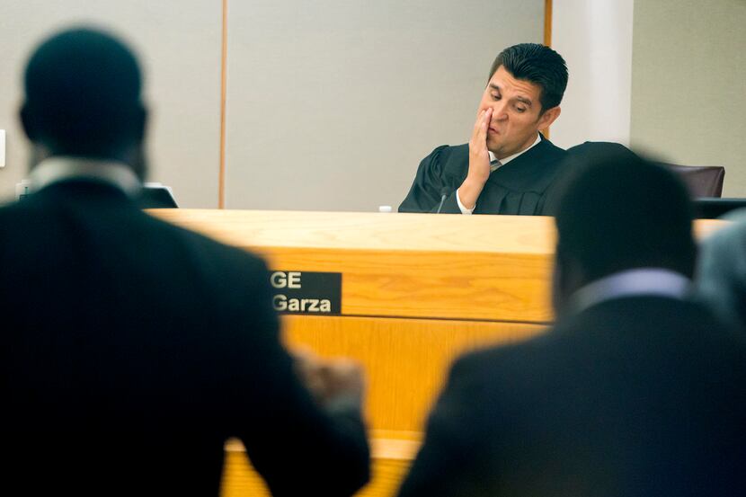 Judge Hector Garza held defense attorney Andrew Wilkerson (left) in contempt in his Dallas...