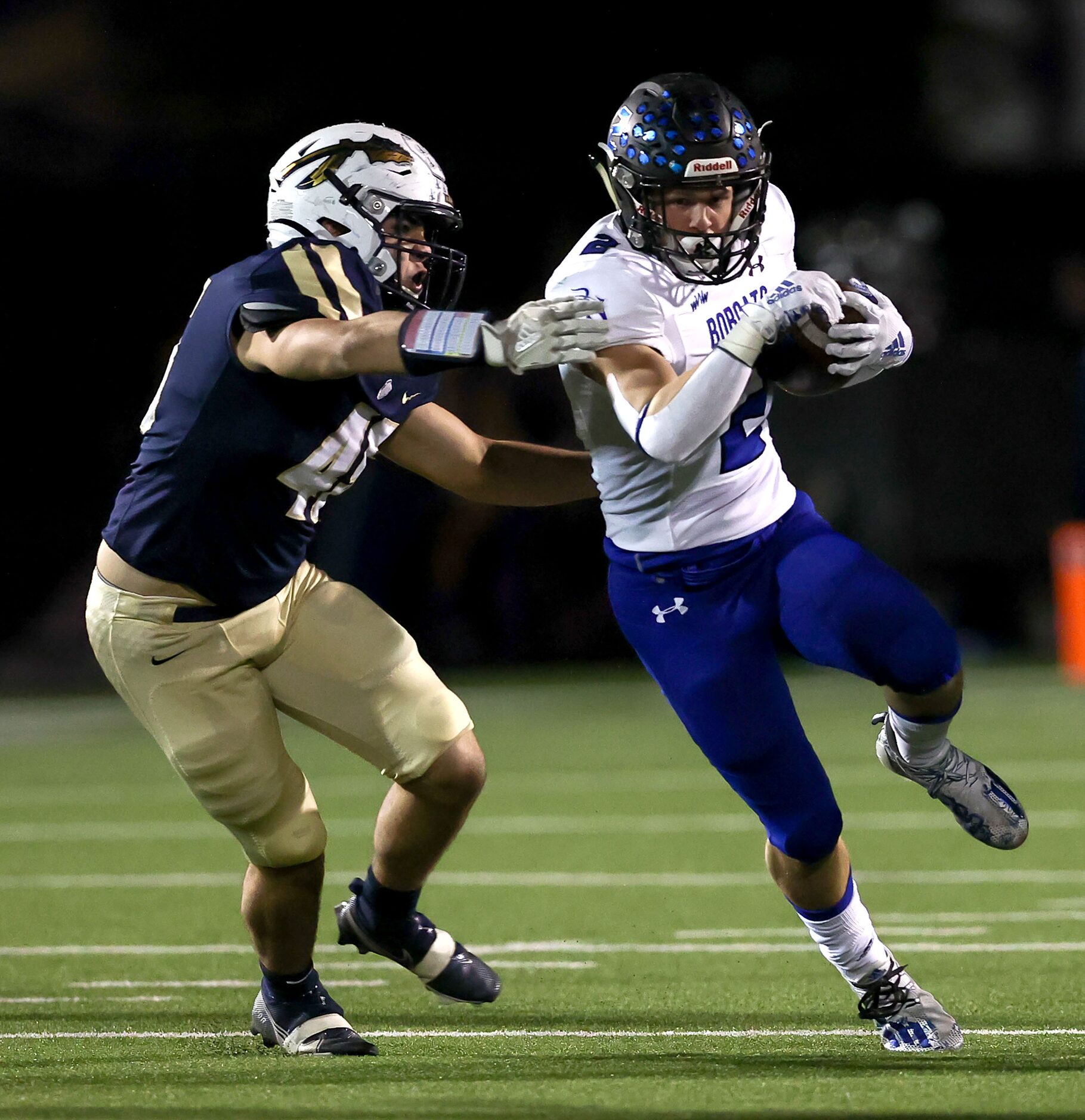 Byron Nelson running back Aaron Darden (2) tries to get past Keller defensive lineman...