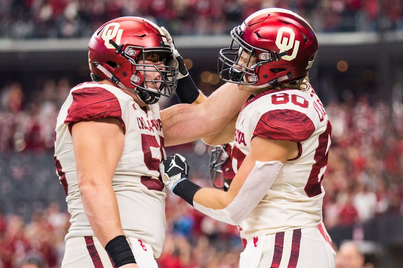 Oklahoma Sooners tight end Grant Calcaterra (80) celebrates a touchdown with offensive...