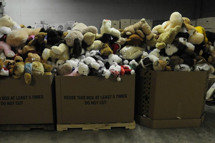Donations sit in boxes at a warehouse in Newtown, Connecticut, on Thursday, December 27,...