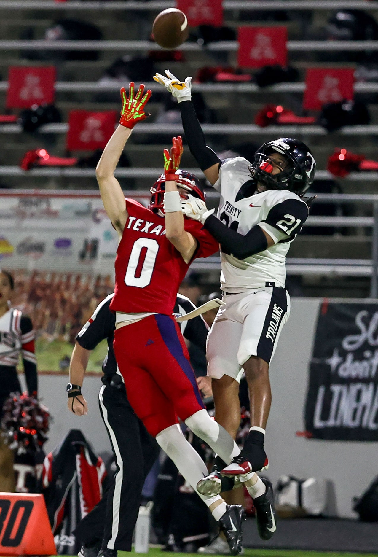 Justin Northwest wide receiver Tyler Singer (0) goes up for a reception as he is defended by...